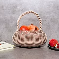 Wicker Basket With Pomegranates Open Book Eyeglasses And Plate With Sliced Pomegranate