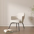 Modern Light Colored Dining Chair with Armrests Black Metal Legs Open Book Green Plant Wooden Floor