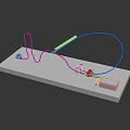 Electronic Components Model With White Platform Blue Wires Connectors And Gray Box