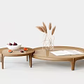 Two Round Rattan Coffee Tables with Open Book Fruits and Pampas Grass Decor