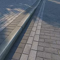 Outdoor Brick Paved Pathway With Concrete Curb And Interlocking Pattern Design