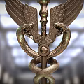 Ornate Weapon Design With Engraved Wings And Coiled Snakes On Metallic Staff