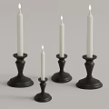 Lit White Decorative Candles On Black Candle Holders With Sturdy Bases For Home Decor