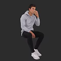A Man Sitting And Drinking In Gray Hoodie Black Pants White Sneakers With Brown Cup