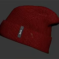 Red Soft Ribbed Knit Beanie With Tag On Gray Background