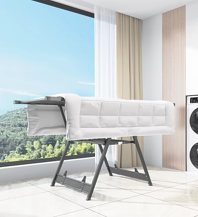 Foldable Metal Clothes Drying Rack With White Quilt Indoor By Window And Mountain View 3d model