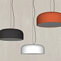 Modern Dome Shaped Pendant Lights in Black Red White Hanging Against Textured Wall