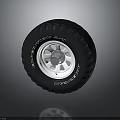 Black Car Tire With Silver Alloy Rim And Tread Pattern Design