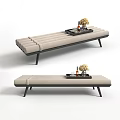 Beige Upholstered Ottoman with Black Legs and Decorative Tray Holding Flowers Wine Bottles