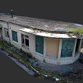 Abandoned Industrial Factory Building With Dilapidated Exterior Broken Windows And Moss Covered Roof