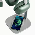 Modern Desktop Computer Setup With Monitor Keyboard Mouse Headphones Phone Stand Notebooks And Green Plant