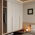 Modern Wardrobe With White Doors And Wooden Frame In Bedroom Setting With Hanging Coat