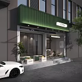 Green Awning Coffee Shop Storefront With Glass Doors Outdoor Seating And Plants