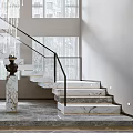 Modern Marble Staircase With Black Metal Railing And LED Strip Lights In Bright Interior