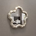 Decorative Flower Shaped Mirror With White Gold Spherical Decorative Frame Reflects Bedroom Interior
