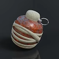 Reddish Brown Grenade Weapon Wrapped With Beige Cloth Straps Top Fuse And Metal Ring