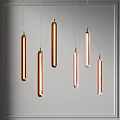 Modern Copper And Transparent Pendant Lights With Long Cylindrical Design Hanging On Gray Background