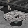 Round Marble Coffee Table With Black Base And Small Side Table Near Sofa With Decor