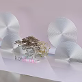 Modern Indoor Decorative Plant With Silver Circular Decor Panels On White Display Shelf
