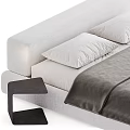 Modern Minimalist Bed Design With Gray White Bedding And Black Nightstand