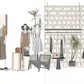 Chic Fashion Display Setup With Mannequins Apparel Plants And Decorative Grid Wall