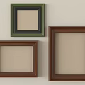 Three Green And Brown Picture Frames In Various Sizes On Wall 3d model
