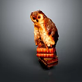 Detailed Brown Owl Statue Perched on a Stack of Old Books