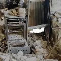 Fire Damaged Kitchen Interior Showing Burned Walls Broken Appliances And Debris