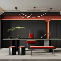 Modern Tea Room With Black Walls Orange Accents Long Table Red Stools And Green Plant