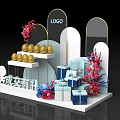Promotion Event Setup With Golden Eggs Gift Boxes Floral Decor And LOGO