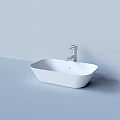 White Square Washbasin with Silver Faucet on Light Colored Wall and Countertop