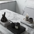 Minimalist Modern Tabletop Decor With Black Bottles Books And Bulb Decor On Marble Surface