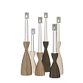 Wooden Candle Holders With Lit White Candles In Various Shapes On Black Background
