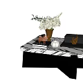 Elegant Coffee Table With Marble Top Black Legs Vase Flowers And Books