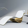 Sleek Modern White And Gold Lounge Chair With Curved Design And Gold Cone Decor