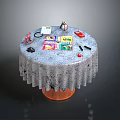 Round Table Scene With Patterned Tablecloth And Colorful Toys Books Stationery