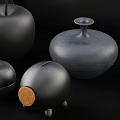 Modern Minimalist Ornamental Decor Set with Black Stacked Discs Apple Shaped Ornaments and Geometric Containers