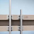 Contemporary Construction Structure With Metal Frame Glass Panels And Concrete Supports