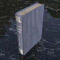 Vintage Dark Blue Hardcover Old Book Resting on Black Marble Tabletop