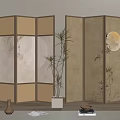 Oriental Room Divider With Lattice Circles And Bamboo Moon Design Alongside Plant Vase And Books