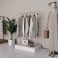Stylish Clothing Store Interior With Hanging Casual Clothes Potted Plant Handbags And Shoes
