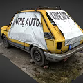 Vintage Yellow Car Covered With White Cloth Having KUPĘ AUTO Text And Roof Rack