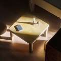 Dining Table Set With Wooden Top Candle Book And Woven Mat In Natural Sunlight