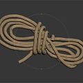 Durable Household Brown Knotted Rope on Smooth Black Surface with Reflection