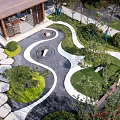 Courtyard Garden Design With Winding Paths Stone Stepping Stones Circular Ornaments And Lush Greenery