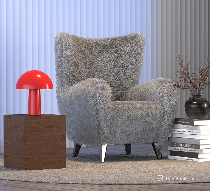 Red Table Lamp on Brown Cube Base Beside Gray Furry Armchair and Stack of Books 3d model 