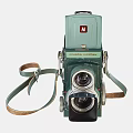 Vintage Camera With Green Body Classic Lens And Retro Leather Strap Design