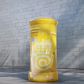Outdoor Yellow Cylindrical Commercial Equipment Featuring CONGOS Branding Against Brick Wall with Palm Tree Shadows