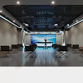 Modern Conference Room With Black Chairs Large Screen Tripod Equipment Grid Ceiling And Lighting