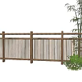 Wooden Fence In Outdoor Garden With Bamboo And Lush Green Plants
